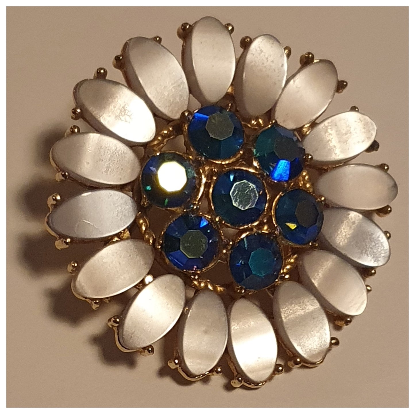 STUNNING BLUE GEM AND LUCITE GOLDTONE METAL BROOCH
