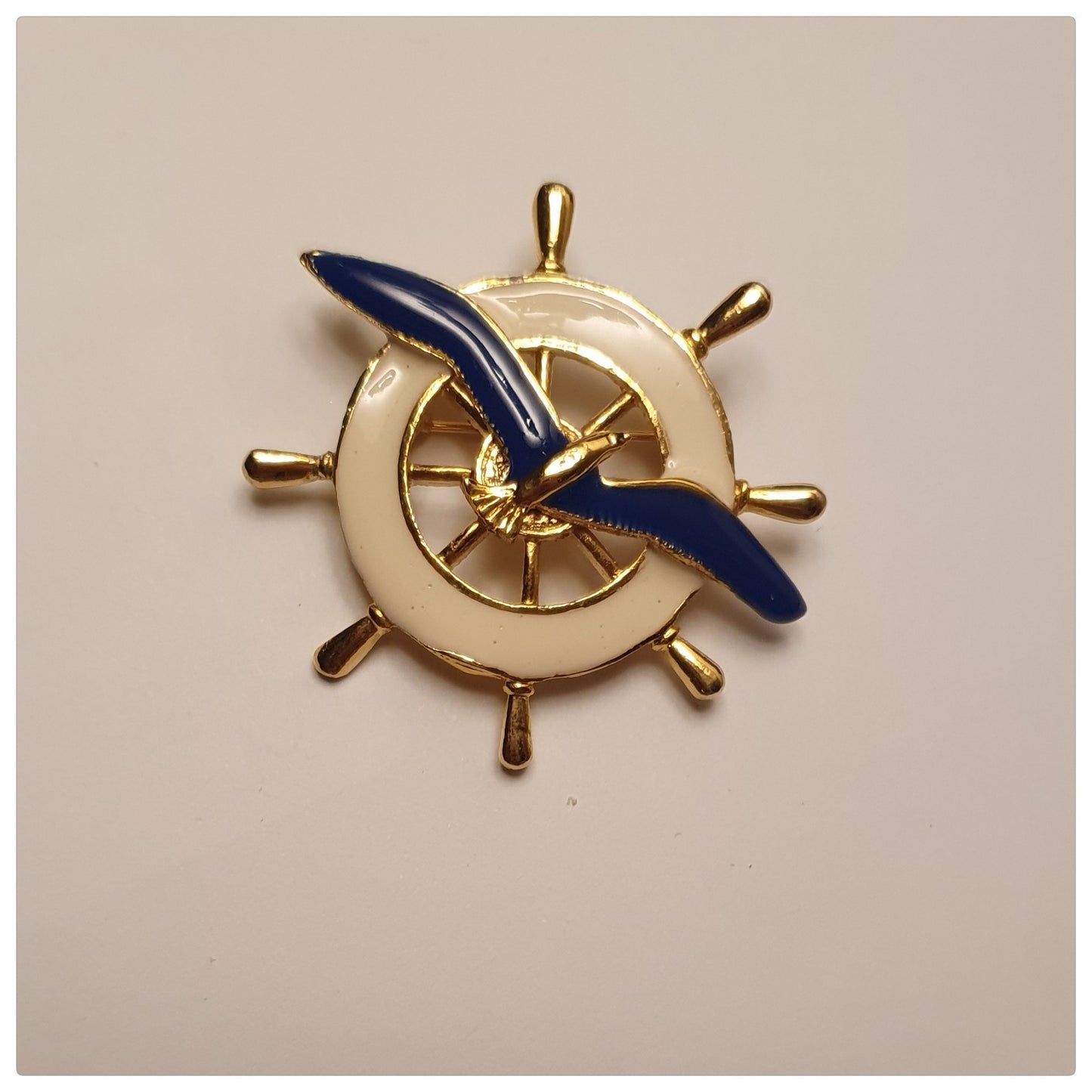 1980s ENAMEL WHITE SHIPS WHEEL AND BLUE SEAGULL
