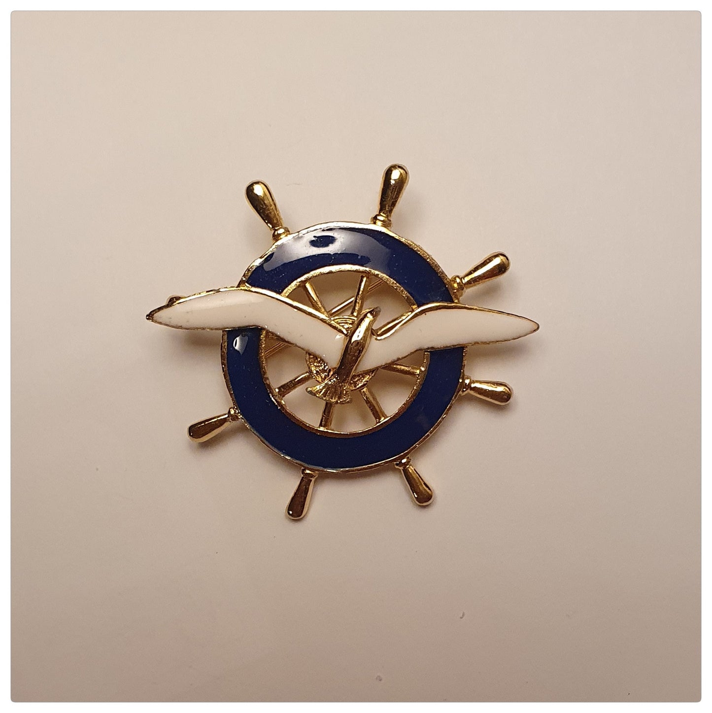 1980s ENAMEL WHITE SHIPS WHEEL AND BLUE SEAGULL