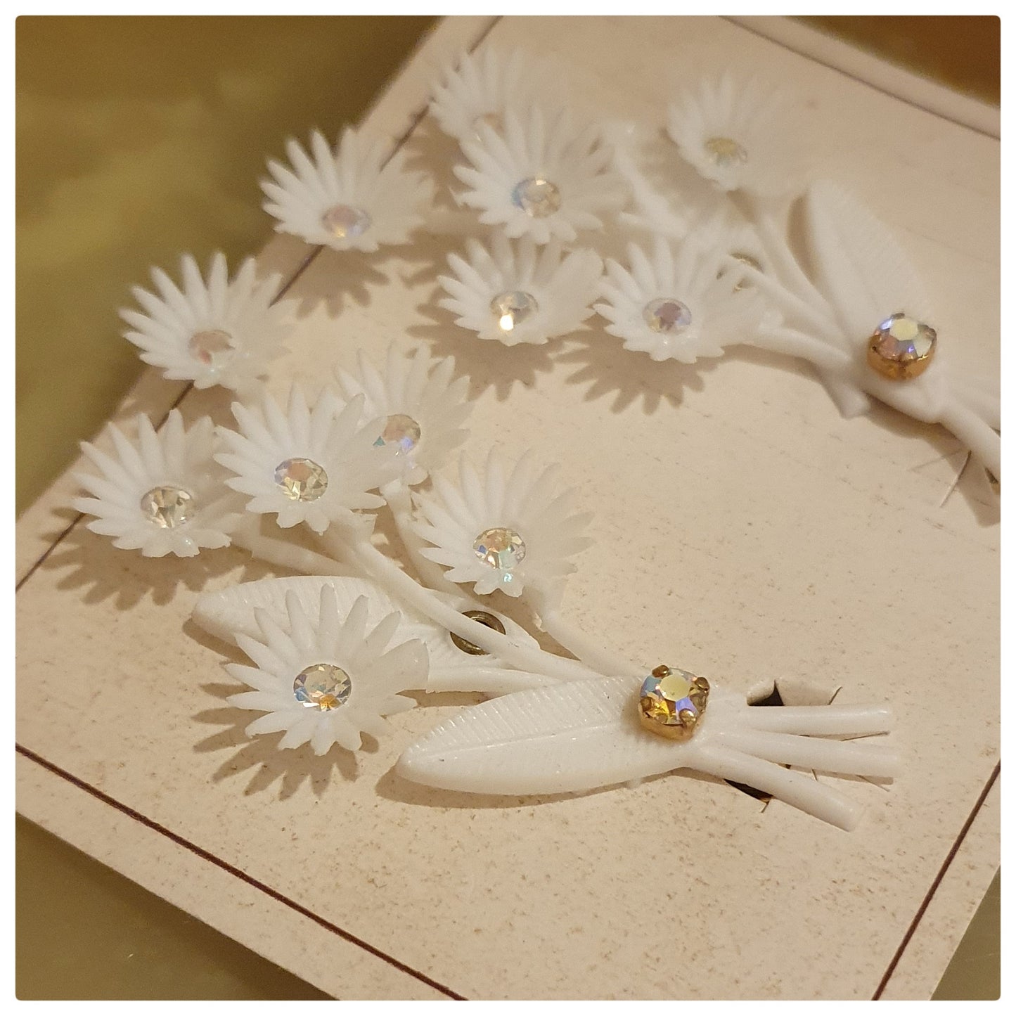 1960s WHITE PLASTIC FLOWER AND DIAMONTE EARRINGS